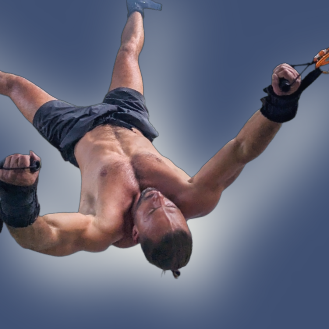 Pravilo session showing a man suspended with arms open and head back, surrendering to a deep gravitational stretch.